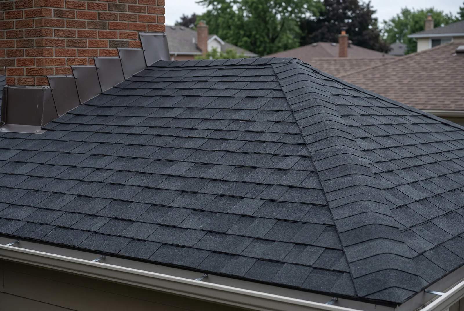 Close view of shingle courses and roof edge detail